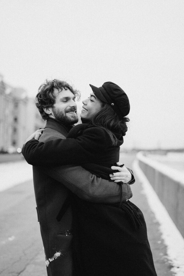 Monochrome Photo Of Woman Hugging Man